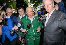 Alan Jones was silent when he left a police station on Monday after being charged with 24 offences. (Bianca De Marchi/AAP PHOTOS)