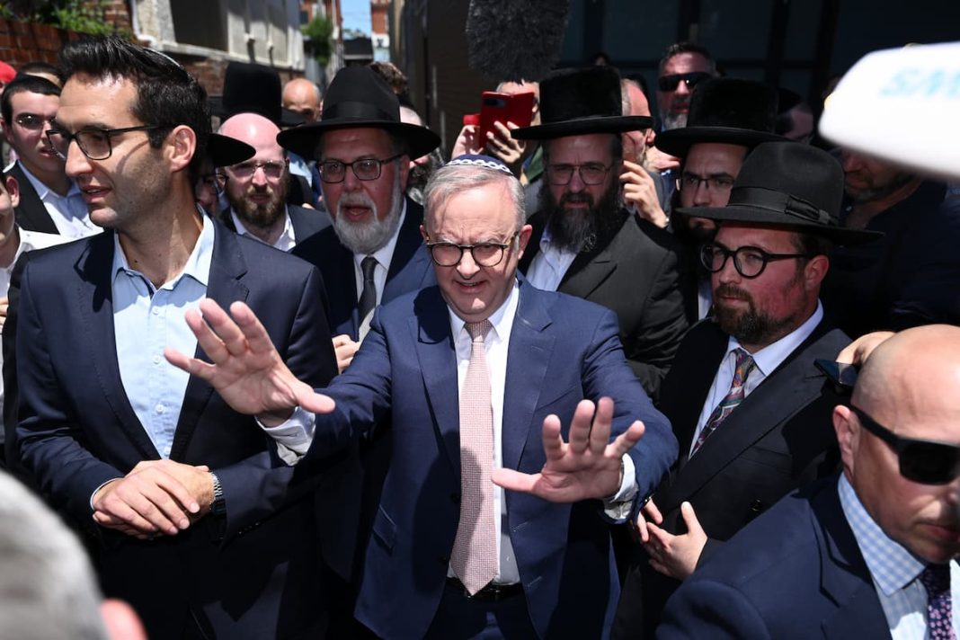 Not everyone was happy to see Anthony Albanese during his visit to the fire ravaged synagogue. (Joel Carrett/AAP PHOTOS)