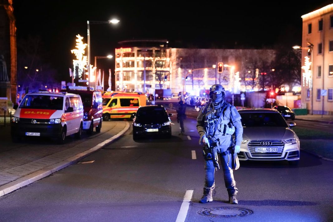 A man has been arrested after a car was driven into the crowd at a Christmas market in Germany. (AP PHOTO)