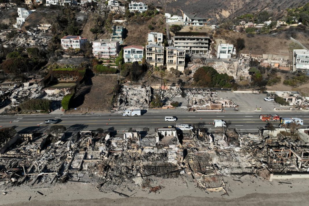 After enduring eight days of devastating fires, LA residents are on alert for new threats. (AP PHOTO)