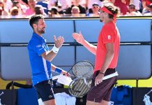 Novak Djokovic (L) quits after losing the first set of his Open semi-final against Alexander Zverev. (James Ross/AAP PHOTOS)